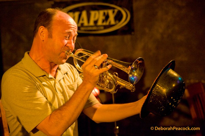 David playing cornet with a bowler hat as a mute