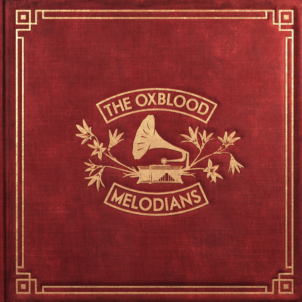 The Oxblood Melodians album cover: gold gramophone emblem on red cloth